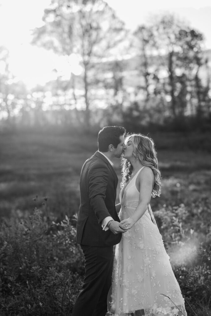 A couple leans in for a kiss.